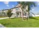 Charming two-story home features well-manicured landscaping, a spacious driveway, and a two-car garage at 13529 Wild Ginger St, Riverview, FL 33579