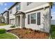 Inviting front porch and meticulous landscaping add curb appeal to this charming two-story home at 13529 Wild Ginger St, Riverview, FL 33579