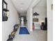 Open hallway features tile floors, neutral paint, and natural light throughout at 13529 Wild Ginger St, Riverview, FL 33579