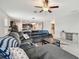 Open-concept living room features tile floors and provides an open layout with the kitchen area at 13529 Wild Ginger St, Riverview, FL 33579