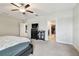 View of main bedroom featuring a ceiling fan, walk-in closet, and access to other rooms at 13529 Wild Ginger St, Riverview, FL 33579