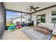 Covered patio with outdoor furniture, offering a great space for entertaining and relaxing at 13529 Wild Ginger St, Riverview, FL 33579
