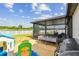 Screened patio area adjacent to a large fenced backyard that is perfect for outdoor entertainment at 13529 Wild Ginger St, Riverview, FL 33579