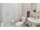 Clean powder room with neutral paint, a pedestal sink, and modern fixtures at 13529 Wild Ginger St, Riverview, FL 33579