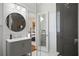 Updated bathroom featuring walk-in shower, modern vanity, and access to bedroom at 136 W Davis Blvd, Tampa, FL 33606