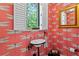 Charming powder room with bold dragonfly wallpaper, pedestal sink, and window at 136 W Davis Blvd, Tampa, FL 33606