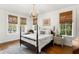 Bedroom with wood floors and plenty of natural light from multiple windows at 136 W Davis Blvd, Tampa, FL 33606