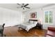 Bright bedroom with wood floors, ceiling fan, and a minimalist design at 136 W Davis Blvd, Tampa, FL 33606