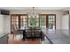 Dining area with wood dining table, and wood-framed French doors at 136 W Davis Blvd, Tampa, FL 33606