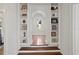 Hallway featuring built-in bookshelves and an arched doorway at 136 W Davis Blvd, Tampa, FL 33606