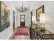 Inviting hallway featuring hardwood floors, decorative lighting, and stylish decor at 136 W Davis Blvd, Tampa, FL 33606