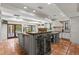 Expansive kitchen features dual islands, neutral cabinets, terra cotta floors, and outdoor access at 136 W Davis Blvd, Tampa, FL 33606