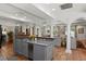 Open concept kitchen with kitchen island, and adjacent living spaces at 136 W Davis Blvd, Tampa, FL 33606