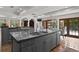 Kitchen island with countertop dining, stainless steel sink, and custom storage at 136 W Davis Blvd, Tampa, FL 33606