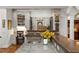 Kitchen island with a sink, bar seating, marble countertop, and custom cabinetry at 136 W Davis Blvd, Tampa, FL 33606