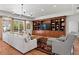 Spacious living room featuring a large built-in shelving unit and stylish furnishings at 136 W Davis Blvd, Tampa, FL 33606