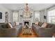 Elegant living room with a fireplace, built-in shelving, and comfortable seating at 136 W Davis Blvd, Tampa, FL 33606