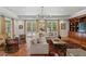 Bright living room with terracotta tile flooring, decorative rug, and french doors at 136 W Davis Blvd, Tampa, FL 33606