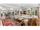 Spacious living room with fireplace, beamed ceilings, tile flooring, and lots of natural light at 136 W Davis Blvd, Tampa, FL 33606