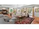 Large living room with tile flooring, neutral sectional, and multiple glass doors at 136 W Davis Blvd, Tampa, FL 33606