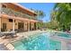 Gorgeous pool area with backyard and patio, with a covered seating area, perfect for outdoor living at 136 W Davis Blvd, Tampa, FL 33606