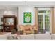 Sitting area with window views, a plush chair, and elegant decor, creating a cozy retreat at 136 W Davis Blvd, Tampa, FL 33606