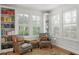 Cozy sitting area with built-in bookshelves and comfortable leather chairs at 136 W Davis Blvd, Tampa, FL 33606