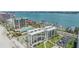 Aerial view of multiple buildings near the beach with views of the surrounding water at 1400 Gulf Blvd # 306, Clearwater Beach, FL 33767