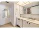 Bright bathroom featuring a vanity with a sink, mirror, and view into another room at 1400 Gulf Blvd # 306, Clearwater Beach, FL 33767