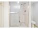 Bathroom shower featuring a sliding door with a shower head and built in shelving at 1400 Gulf Blvd # 306, Clearwater Beach, FL 33767