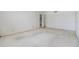 Bright, carpeted bedroom with neutral walls and an open door to another room at 1400 Gulf Blvd # 306, Clearwater Beach, FL 33767