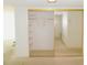 Spacious walk-in closet with sliding mirrored doors and built-in shelving at 1400 Gulf Blvd # 306, Clearwater Beach, FL 33767