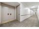 Condo hallway with neutral carpet, trim and doors at 1400 Gulf Blvd # 306, Clearwater Beach, FL 33767