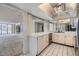 Bright kitchen with white cabinets and stainless steel appliances, adjoins carpeted living space at 1400 Gulf Blvd # 306, Clearwater Beach, FL 33767