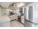 Modern kitchen with stainless steel appliances and white cabinets at 1400 Gulf Blvd # 306, Clearwater Beach, FL 33767