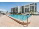 Enjoy the community pool at this condo building with lounge seating and nearby tiki hut at 1400 Gulf Blvd # 306, Clearwater Beach, FL 33767