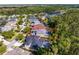 Aerial view of the property highlighting its spacious backyard and location within a friendly residential area at 14851 Tudor Chase Dr, Tampa, FL 33626