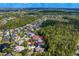 Aerial view of the property with a tree lined backyard within a tranquil residential community at 14851 Tudor Chase Dr, Tampa, FL 33626