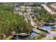 A scenic aerial view showcasing the community entrance, lush green spaces, water features, and residential areas at 14851 Tudor Chase Dr, Tampa, FL 33626