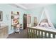 Adorable bedroom with a desk, a charming bed and plenty of natural light at 14851 Tudor Chase Dr, Tampa, FL 33626