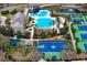 Aerial view featuring an array of community amenities including a pool, sports courts, and recreational facilities at 14851 Tudor Chase Dr, Tampa, FL 33626