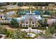 Aerial view of the luxury community clubhouse, pool, and sports courts at 14851 Tudor Chase Dr, Tampa, FL 33626