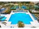 Aerial view of the expansive community pool area with seating and umbrellas at 14851 Tudor Chase Dr, Tampa, FL 33626