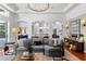 Bright living room featuring neutral walls, hardwood floors, and an open concept design at 14851 Tudor Chase Dr, Tampa, FL 33626