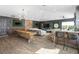 Spacious living room featuring a bar area, game table, and a comfortable seating area at 14851 Tudor Chase Dr, Tampa, FL 33626
