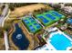 Aerial view of the resort-style pool, tennis, and pickleball courts at 14851 Tudor Chase Dr, Tampa, FL 33626