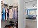 View of walk-in closet with shelving for ample storage, leading into spacious main bedroom at 14851 Tudor Chase Dr, Tampa, FL 33626
