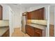 Galley kitchen with stainless steel appliances, countertop, and tile backsplash at 1624 Shady Leaf Dr, Valrico, FL 33596