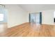 Hardwood floored living room featuring sliding glass doors at 1624 Shady Leaf Dr, Valrico, FL 33596