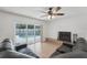 Spacious living room featuring tile floors, sliding glass door, and fireplace at 1624 Shady Leaf Dr, Valrico, FL 33596